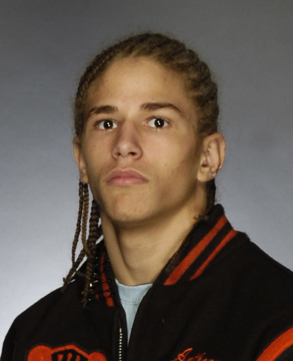 Dreads are gone, but 'Predator' still a force for UT wrestling